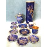 A collection of Maling gilt dragon decorated pieces on Goodes spatter blue ground - a tubular tall