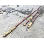 A pair of 5ft mahogany curtain poles with gilded ribbed terminals and gilded rings - 60in; and