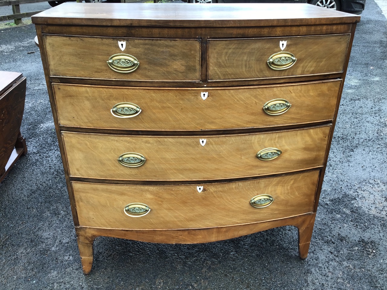 A Georgian mahogany bowfronted chest of drawers, the crossbanded top above two short and three - Image 2 of 3