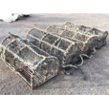 Four rectangular lobster pots with arched frames on grid bases. (46.5in) (4)