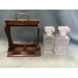 A Victorian oak tantalus with engraved silver plated mounts, having locking mechanism to bar