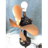 A C20th painted cast iron fan lamp, the motor on column above circular base with control switch, the