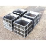 A set of four faux-lead garden planters, the square pots with panelled sides. (11.75in x 11.75in x