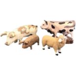 Four animals from a butchers shop display - composition, carved wood, resin, etc, cow sheep &