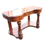 A Victorian mahogany dressing table of breakfront moulded outline having central frieze drawer