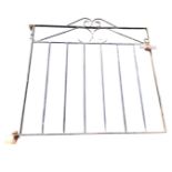 A wrought iron garden gate with scrolled decoration above panel of tubular bars. (35in x 35.5in)
