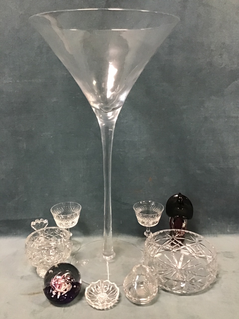 Miscellaneous glass including a massive tapering handmade champagne glass, cut crystal bowls, a