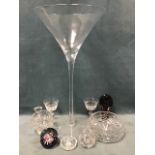 Miscellaneous glass including a massive tapering handmade champagne glass, cut crystal bowls, a