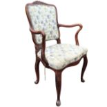 A nineteenth century French elm country armchair, the shield shaped upholstered back with leaf