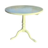 A painted nineteenth century mahogany circular snap-top occasional table, supported on a turned
