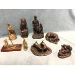 Four faux bronze groups - three dogs and an owl; and four brass faux-coal mining figures/