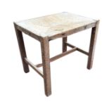 A 1930s limed oak stool with rectangular rush seat on square column legs joined by rectangular