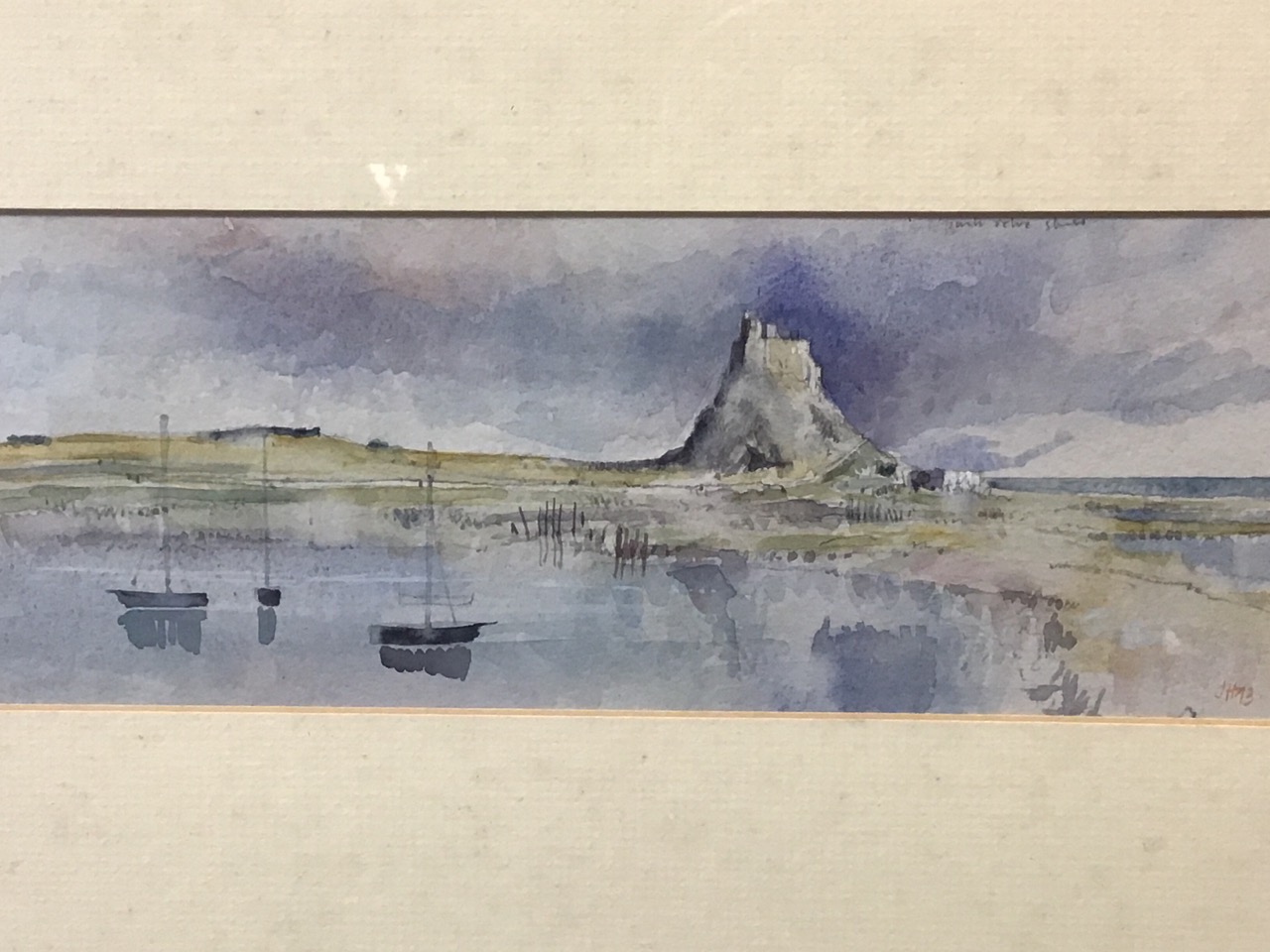 John Hutchinson, watercolour, Lindisfarne coastal view, signed with monogram, labelled to verso, - Image 2 of 3