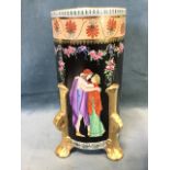 A large Maling cetemware tubular vase decorated with Grecian couples on black ground framed by