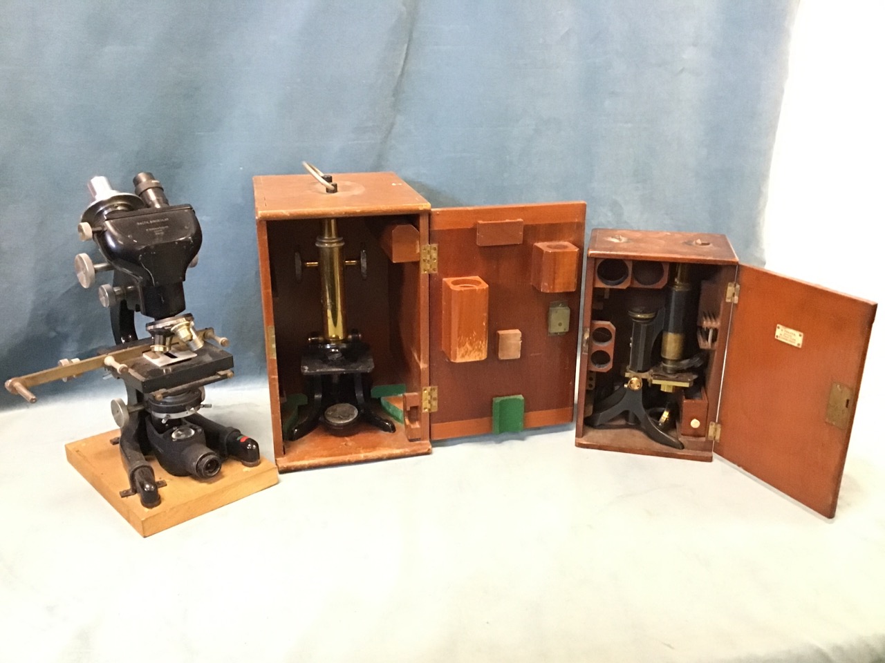 A large microscope by W Watson & Sons Ltd, the bactil binocular with electric light, four lenses,