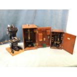 A large microscope by W Watson & Sons Ltd, the bactil binocular with electric light, four lenses,