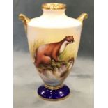 A signed & handpainted Aynsley vase with burnished gilt rim and scrolled handles, the otter wildlife