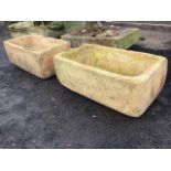 A pair of composition stone troughs of rectangular rounded form. (28.5in x 16in x 11.5in) (2)