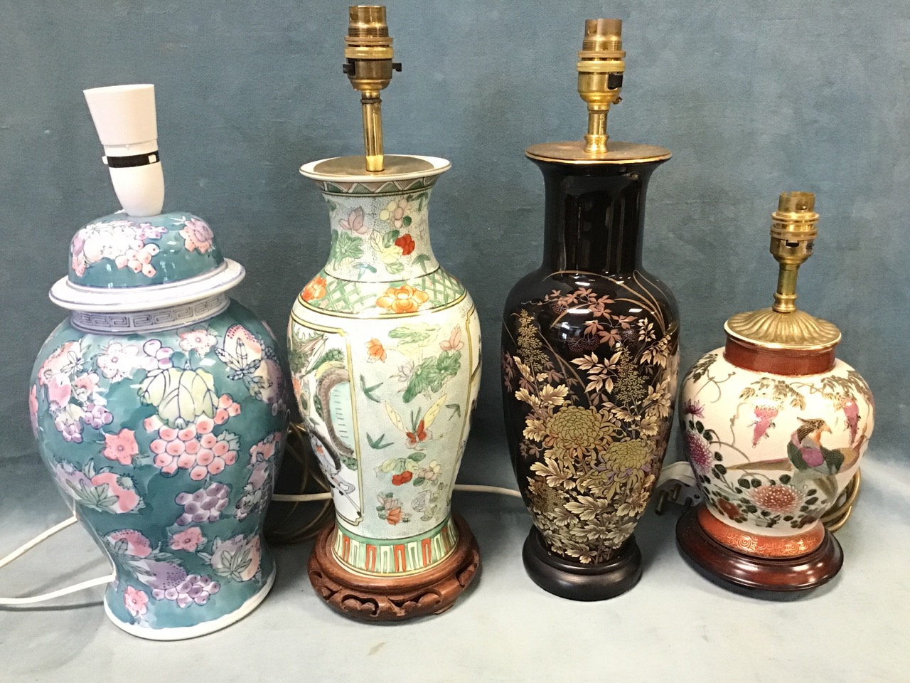 Four chinoiserie ceramic vase type tablelamps - family verte on carved stand, cloisonné style on