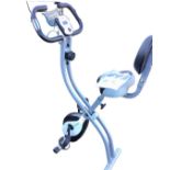 An Ultrasport exercise bicycle, the foldable home trainer with adjustable seat, electronic dash