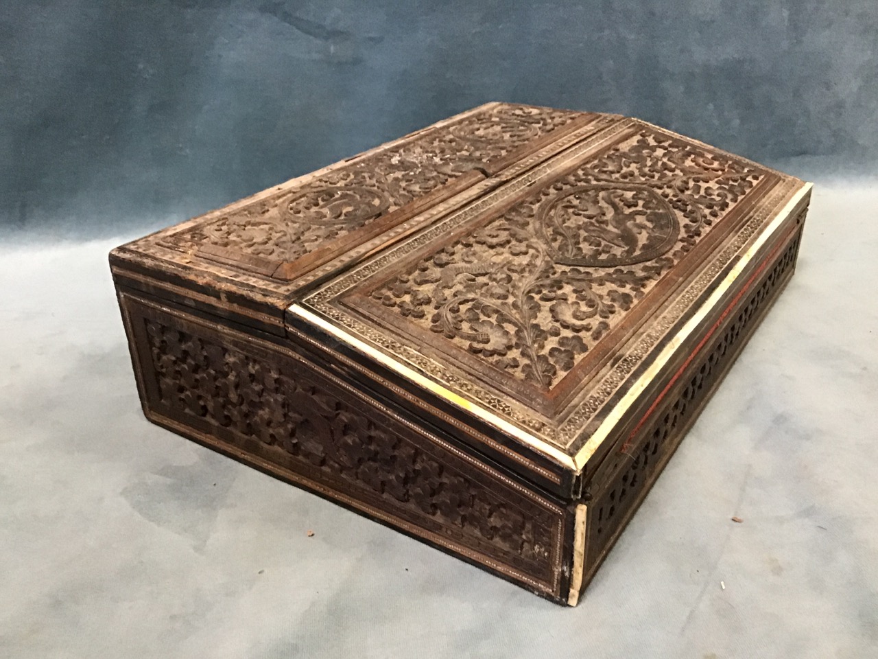 A late Victorian anglo-indian writing box, with two hinged covers carved with animal and birds - Image 3 of 3