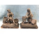 A pair of late nineteenth century European pewter models of a cobbler and washerwoman, the working