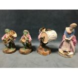 A set of three European porcelain frog musicians, the beasts in pink frock coats holding