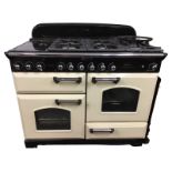 A Rangemaster gas/electric cream enamelled cooker, the Classic Deluxe model with five rings flanking