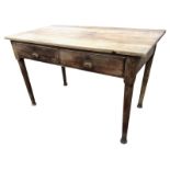 An oak side table with rectangular top above frieze with two drawers mounted with brass cup handles,