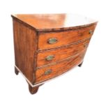 A nineteenth century mahogany bowfronted chest of three long cockbeaded drawers mounted with oval