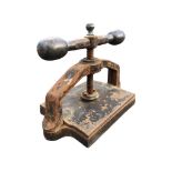 A rectangular Victorian cast iron book press with copper mounts to screw handle. (16.75in)