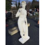 A painted three-quarter lifesize garden composition stone classical statue of Venus with an apple,