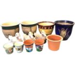 Four sgraffito stoneware glazed garden pots, and other terracotta plantpots - some with