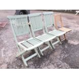 A set of three painted folding garden chairs with slatted backs and seats - some damage; and a