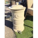 A Victorian stoneware water filter by G Cheavins, the tubular vessel with domed cover - damaged,