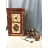 An American wallclock by Seth Thomas with rectangular mahogany cushion moulded case and dial with
