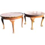 A circular walnut coffee table, the top with gadrooned carved edge above a plain apron, raised on