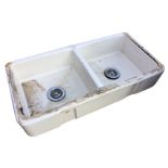 An Adelphi double Belfast sink, each rounded basin with integral overflow, having chrome waste. (