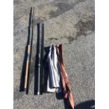 An Abu Carbon Specimen 11ft two-piece spinning rod with sleeve; and an Avanti Argenta 12ft three-
