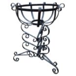 A painted wrought iron plant stand with circular bowl on triangular scrolled legs and feet. (14.