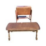 A rectangular mahogany sewing box with tablet mounted hinged lid revealing an interior with trays,