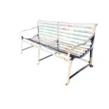 A heavy Victorian 6ft wrought iron country house bench with iron slats to back and seat having