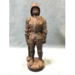 A Victorian cast iron figure of a knight in armour, the helmetted soldier holding mace, raised on
