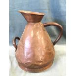 A large Victorian four gallon copper harvest jug, the tapering vessel riveted with tubular