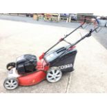 A Cobra rotary garden mower with Briggs & Stratton 650 petrol engine, the machine with adjustable