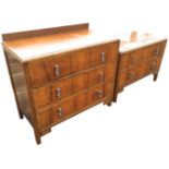 A graduated pair 50s walnut chests with moulded tops above drawers mounted with original chromed