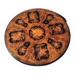 A circular Victorian walnut breakfast table top inlaid with alternating butterfly floral & ribbon