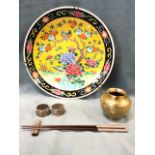 A pair of Chinese hardwood chopsticks with silver mounts on concave block stand; two eastern metal