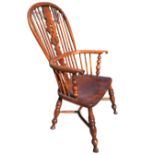 A nineteenth century elm & yew windsor chair, the hooped back on spindles with pierced splat,