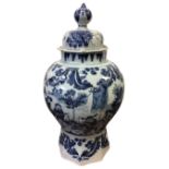 A C17th delft blue & white octagonal baluster vase and cover, painted in Chinese transitional